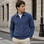 Man styling the haze blue men's corduroy jacket on a quiet US city street.