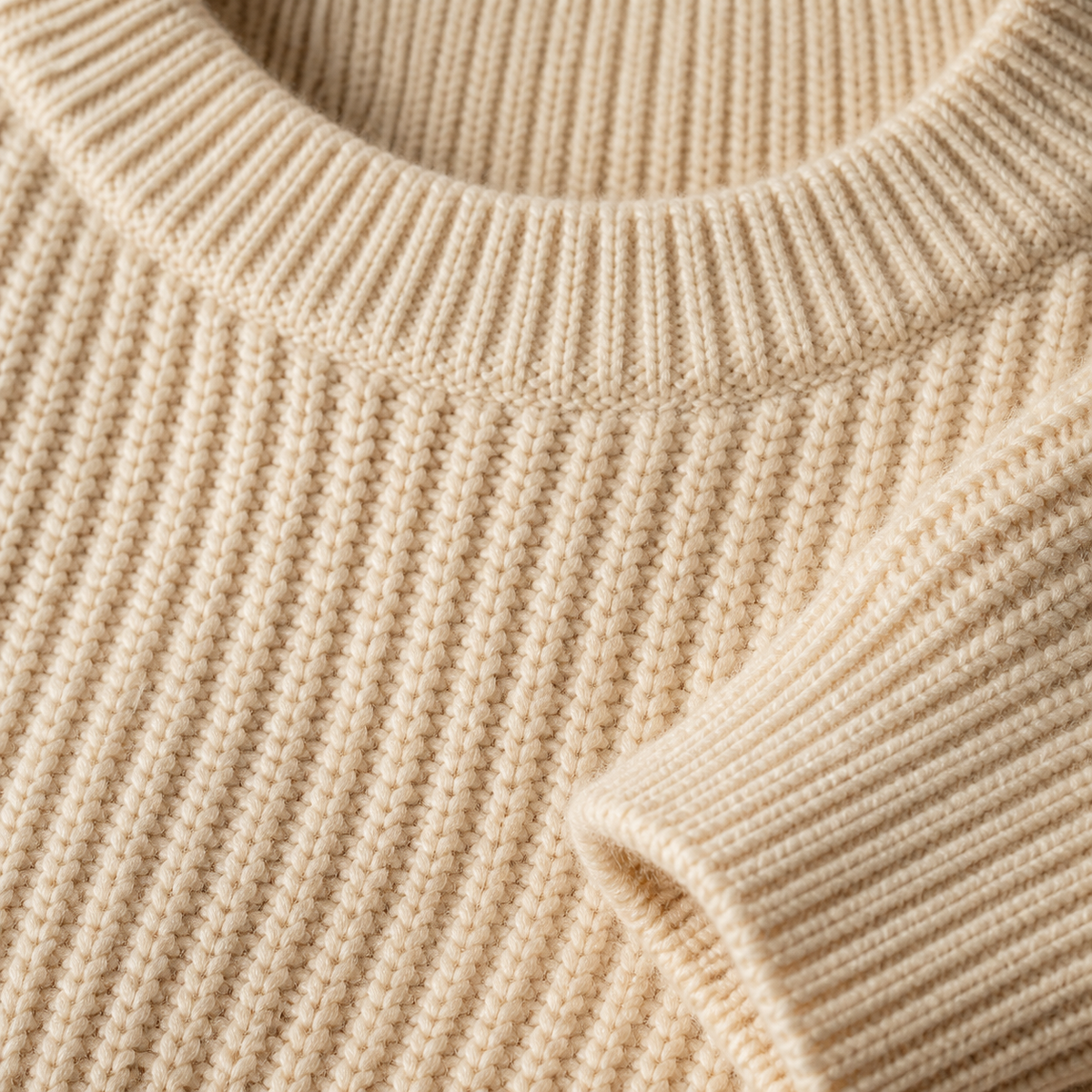 Close view of the light yellow men's crewneck sweater showing its neckline and distinctive surface texture.