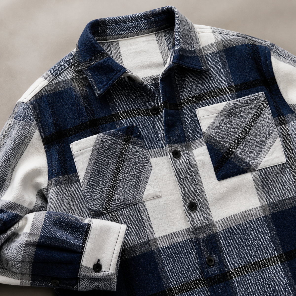 Close view of the blue men's flannel shirt jacket showing its neckline and distinctive surface texture.