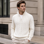 Man styling the white men's half zip sweater on a quiet US city street.