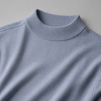 Close view of the sea polish men's mock neck sweater showing its neckline and distinctive surface texture.
