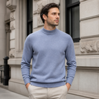 Man styling the sea polish men's mock neck sweater on a quiet US city street.