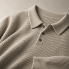 Close view of the oatmeal color men's polo sweater showing its neckline and distinctive surface texture.