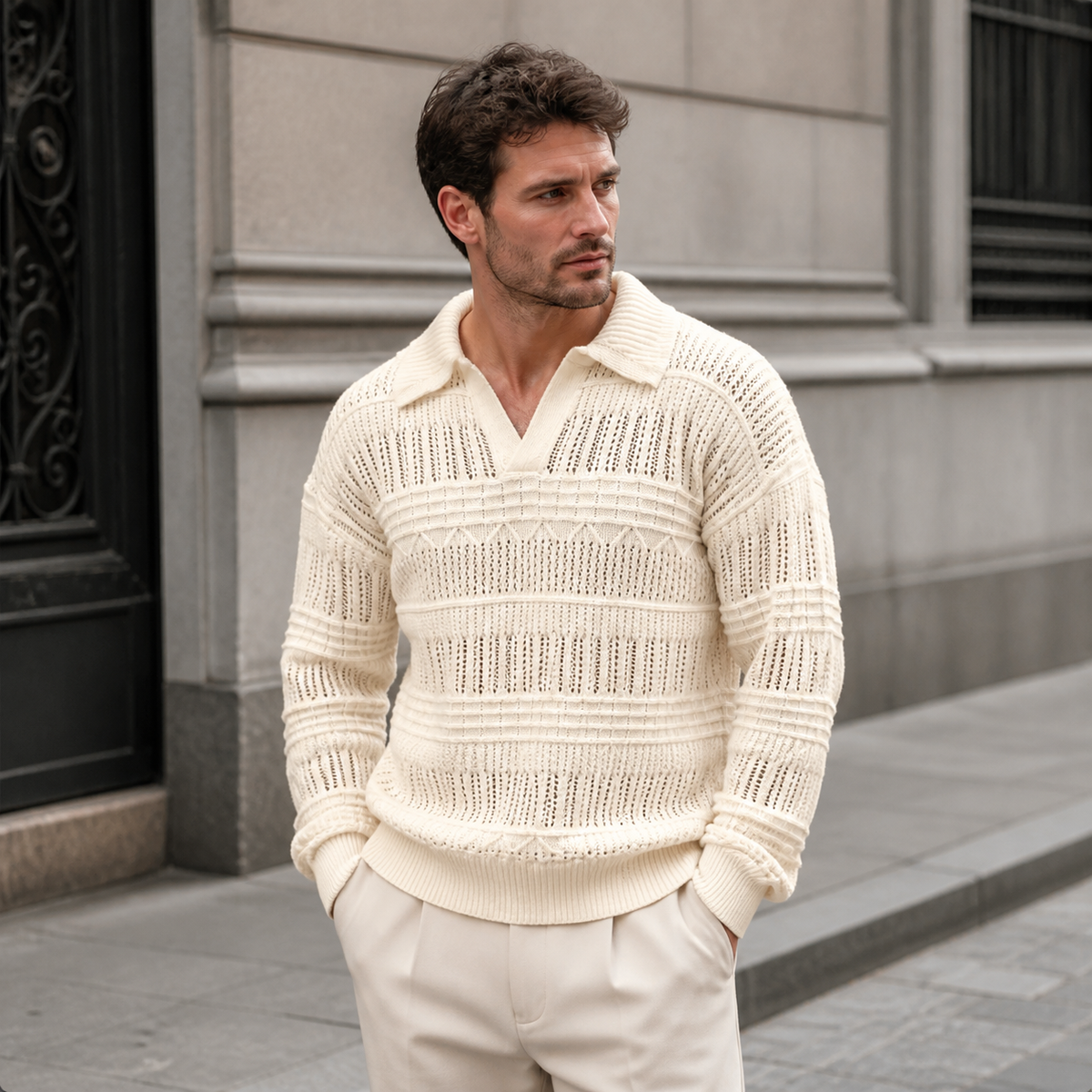 Man styling the apricot men's polo sweater on a quiet US city street.